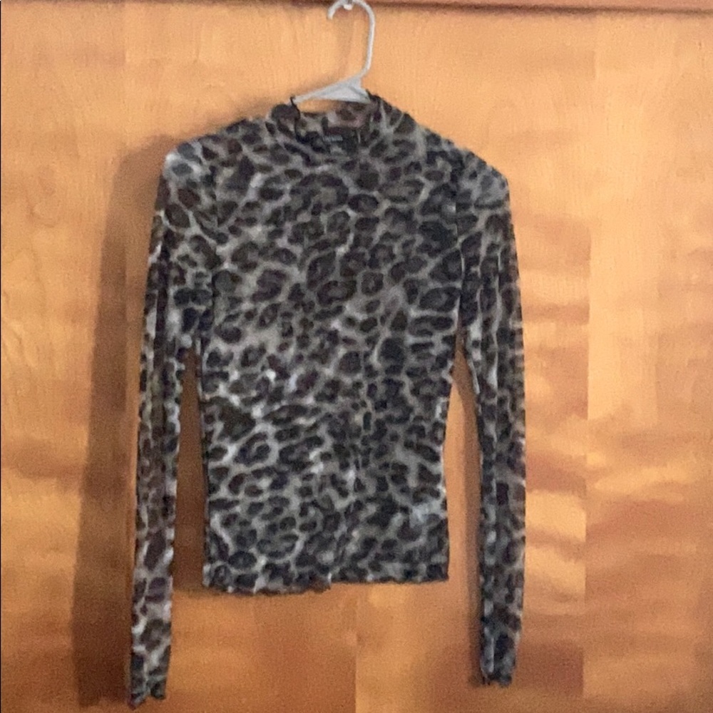 Woman’s sheer leopard print top